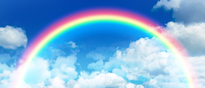 Rainbow in sky with clouds